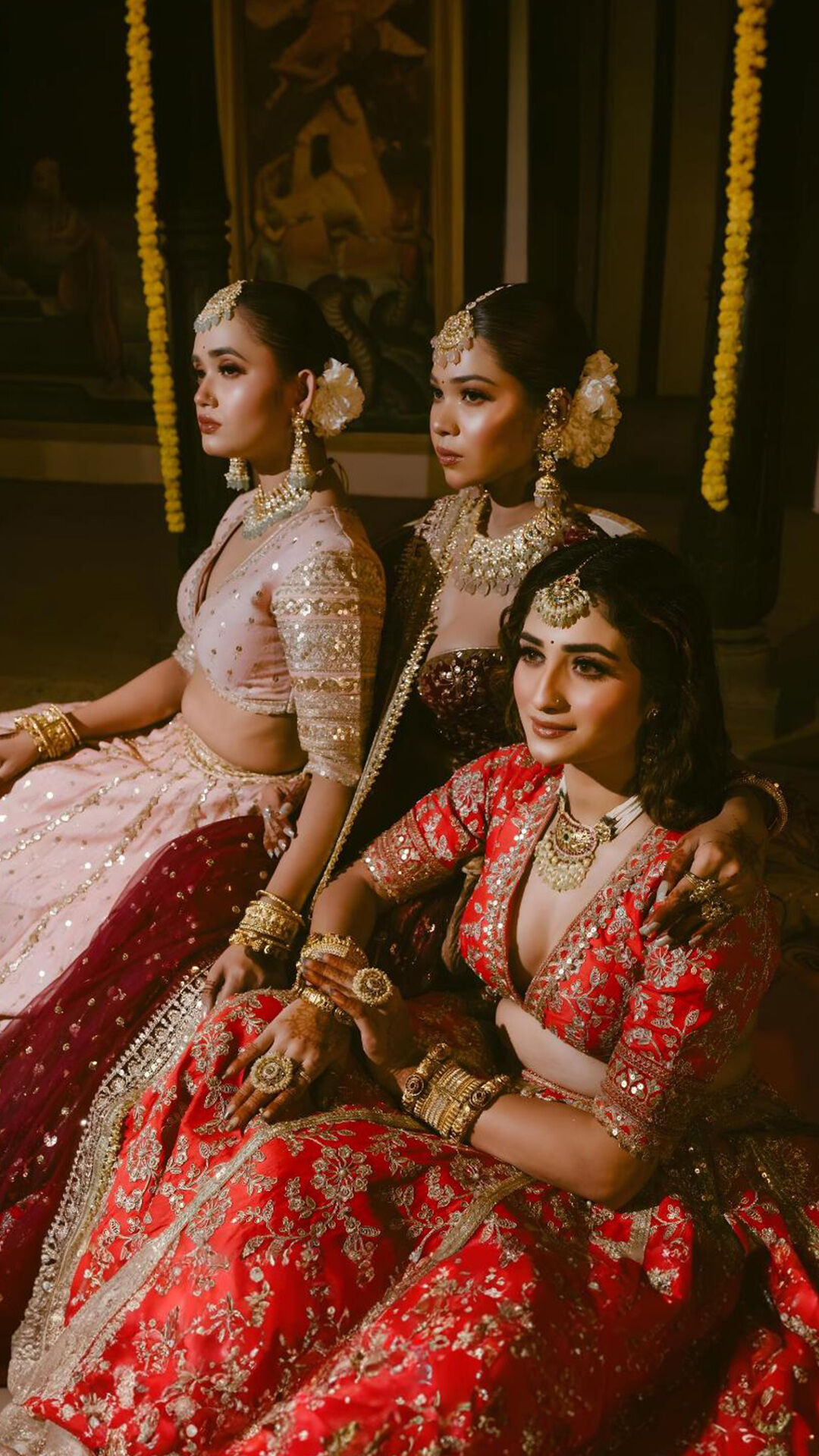Bride and her bridesmaids flaunting modern-style colorful lehengas for a trendy wedding look